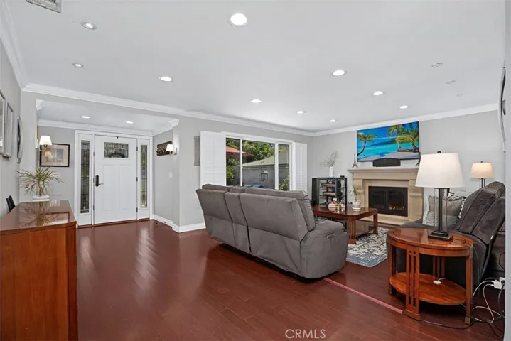 Step inside to an open floor plan featuring rich bamboo flooring, crown molding, recessed lighting, whole house sound system  and light-filled living spaces.
