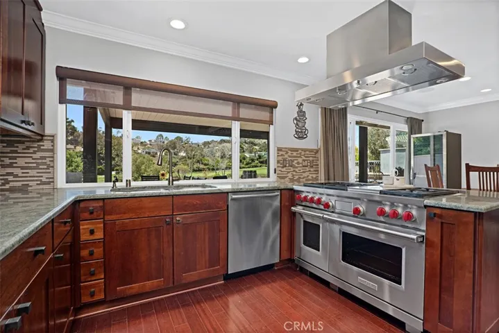 Chef's kitchen overlooking the dining area and Shorecliffs Golf Course.