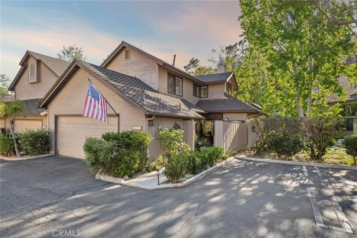 Surrounded by mature trees and lush landscaping, this end-unit home captures the relaxed, park-like setting that makes Sea Bluff Canyon Village so special.
