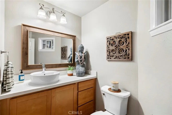 Convenient downstairs powder room with an updated vanity and