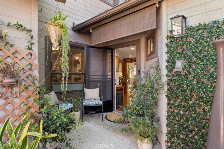 The gated front courtyard offers a peaceful outdoor retreat before you even step inside.