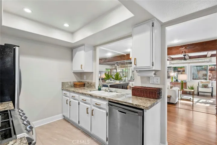 The kitchen's pass-through keeps the chef connected to the dining area.