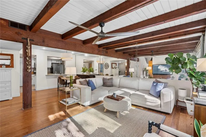 Dramatic exposed wood beam ceilings and expansive living spaces create the heart of the home.