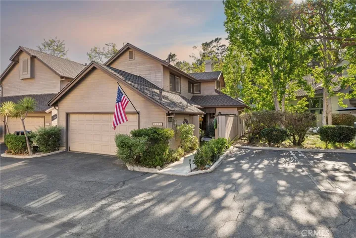 End-unit location offers added privacy, mature trees, an attached two-car garage, and a private gated courtyard entry in one of Costa Mesa's most sought-after communities.