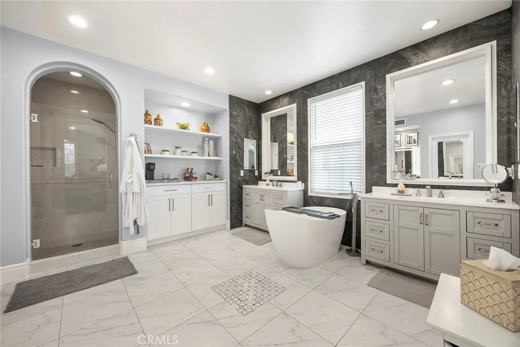 Primary bathroom with separate shower and separate tub.