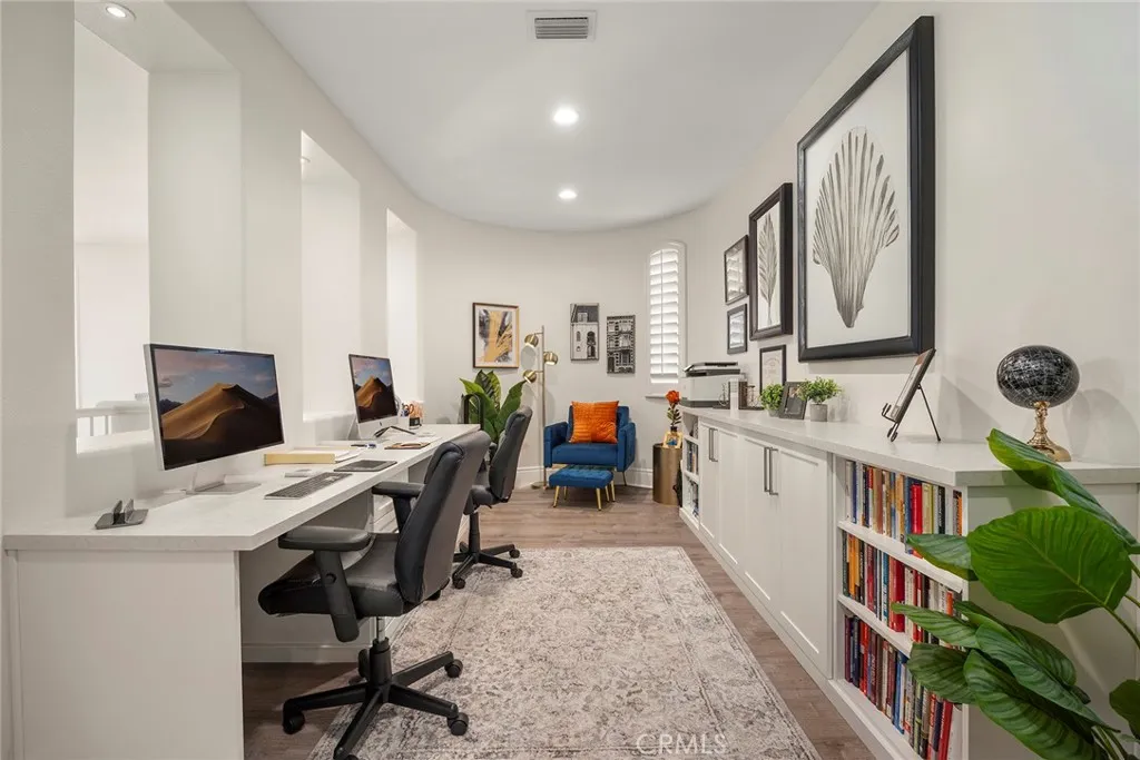 Open office area with built-in cabinets.