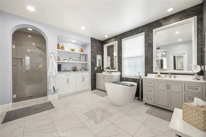 Primary bathroom with separate shower and separate tub.