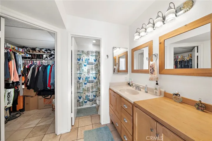 The bathroom has a huge walk-in closet