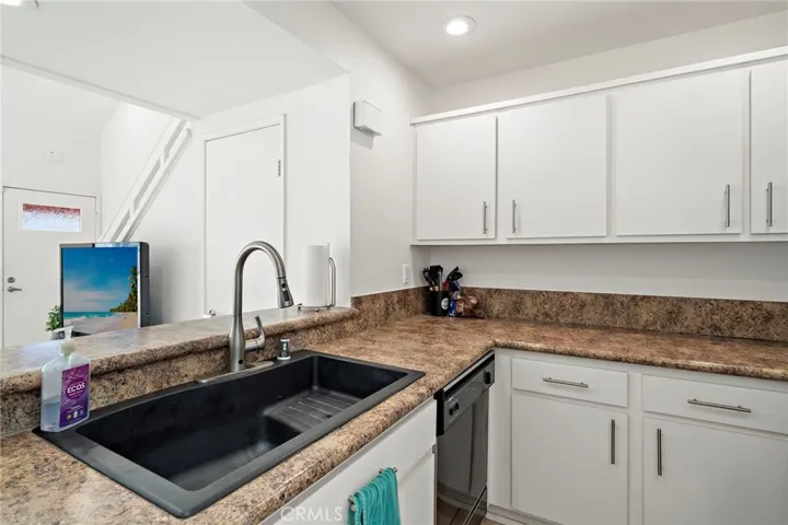 Kitchen is open to living space so it feels connected and open.