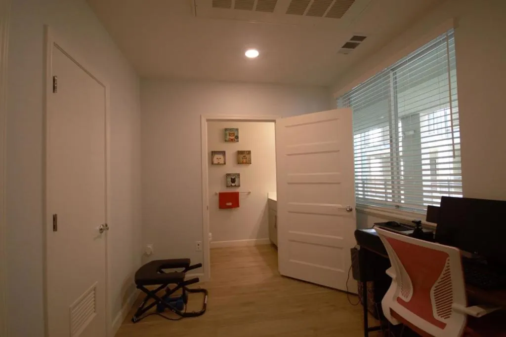 LAUNDRY AREA AND HALF BATH IN DEN