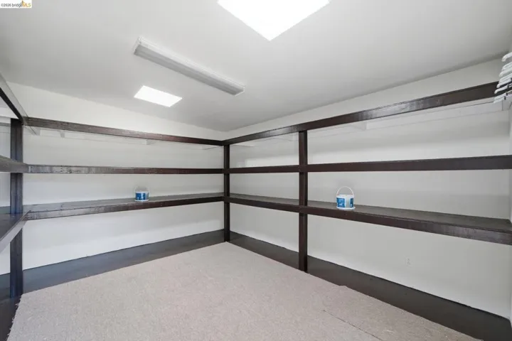 Built-in shelving system with dark wood-finish components