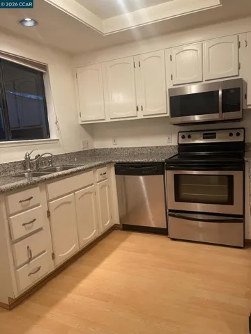 Kitchen with window over looking patio