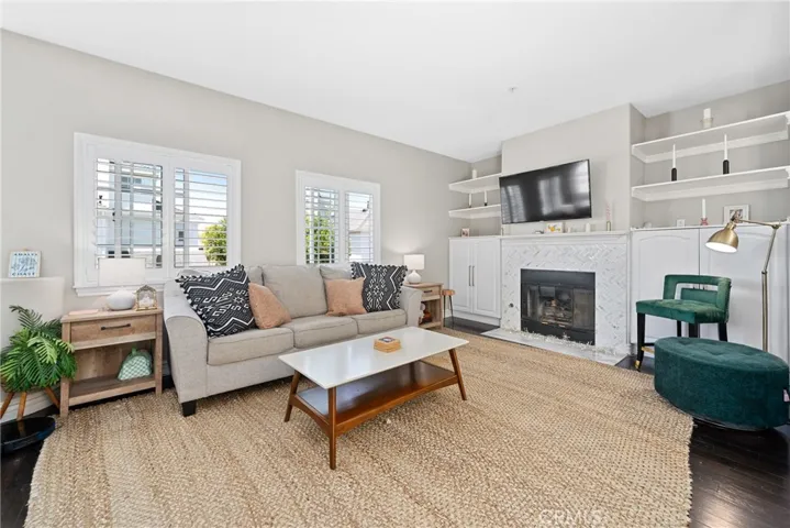 Hardwood flooring, plantation shutters, and shelving add style and fuctionality