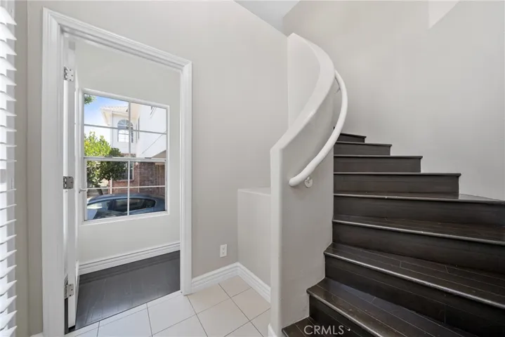 Classic staircase connecting all three levels.
