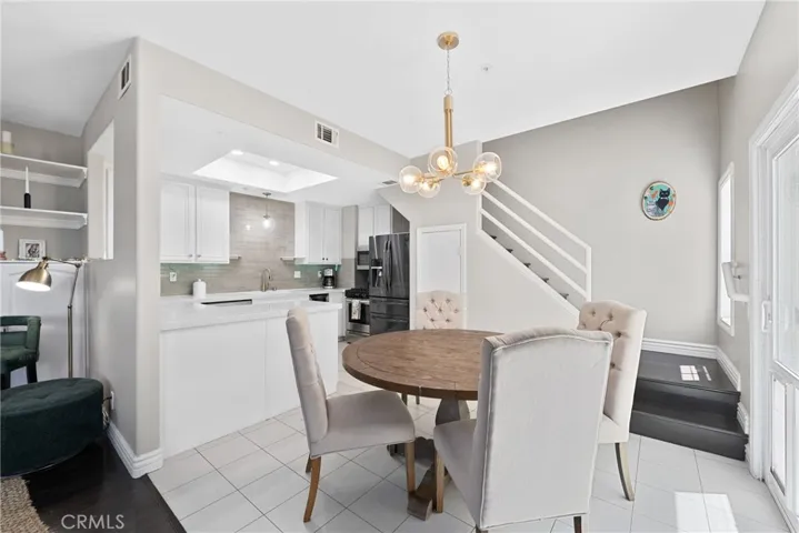 Dining space open to the kitchen and living areas.