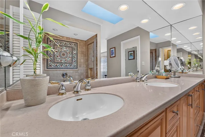 Master suite has walk in closet, spa tub and separate mosaic tiled shower with massage water features.