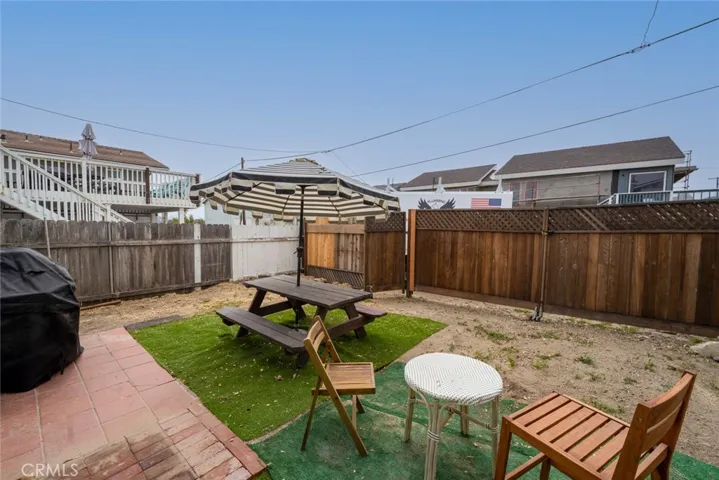 back yard and more parking behind fence