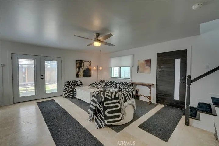 lower level living room and frenchdoors to yard