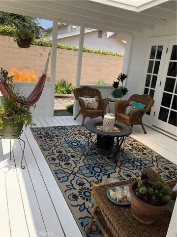 Relax on this charming, covered deck