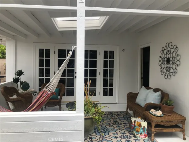 Access from the living/dining rooms through lovely French doors