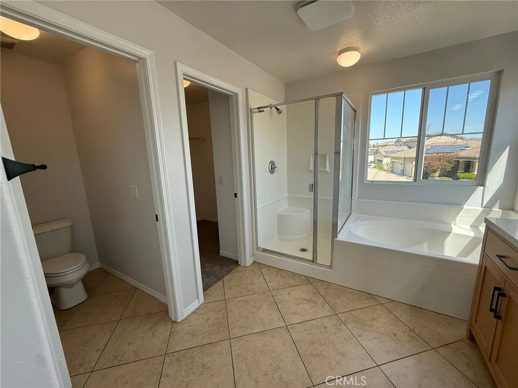 Master bathroom with walk-in closet