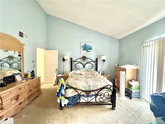 Primary bedroom with balcony attached