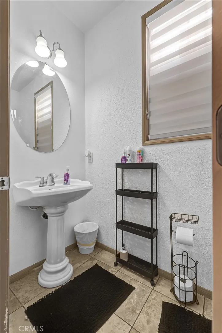 first level restroom, next to garage's door