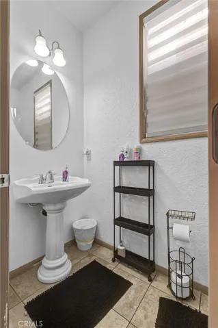 first level restroom, next to garage's door