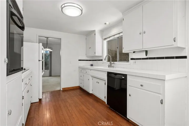 Kitchen opens to living room and family room.
