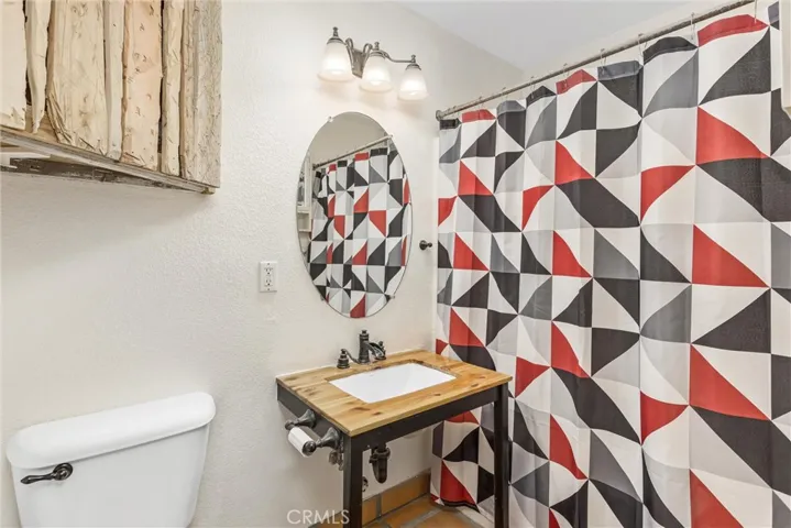 Shared full bath with shower/tub combo