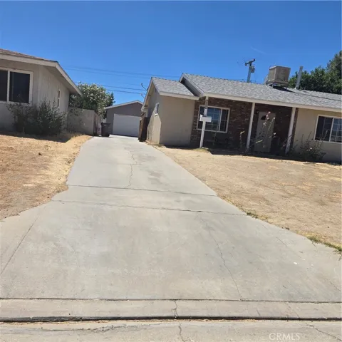 detached garage with good concrete driveway