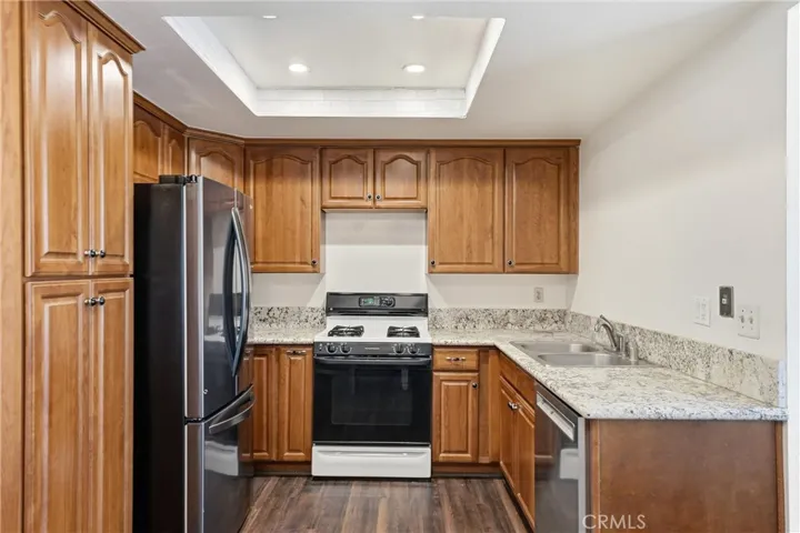Kitchen with Stone Counters and Pantry.