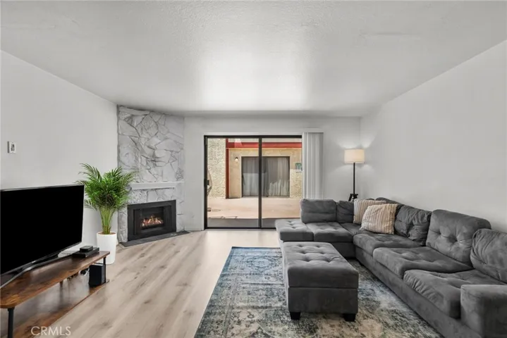 Living Room with Sliding Door to Community Patio Area