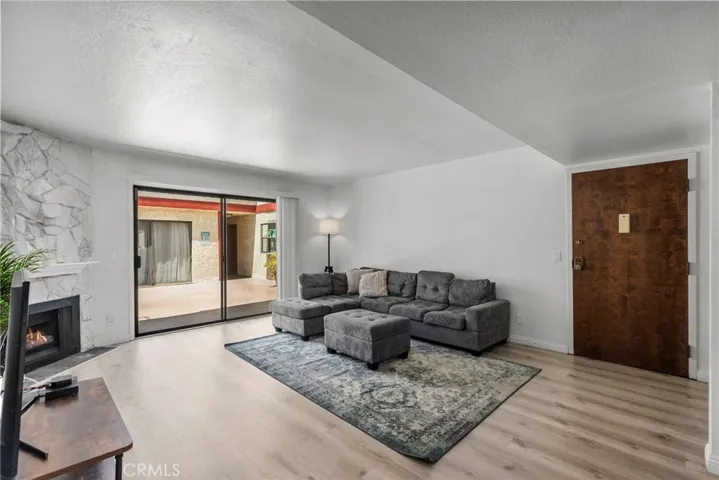  
Living Room with Sliding Door to Community Patio Area