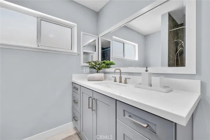 Hall bathroom vanity has ample counter space.