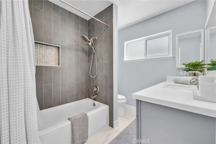 Hall bathroom includes a tub.