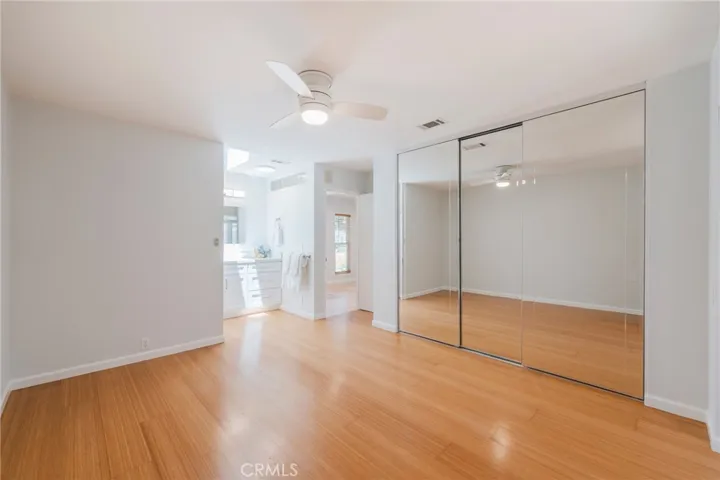 The Primary Bedroom offers a Oversized Wall of Closets and Brand New Mirrored Doors.