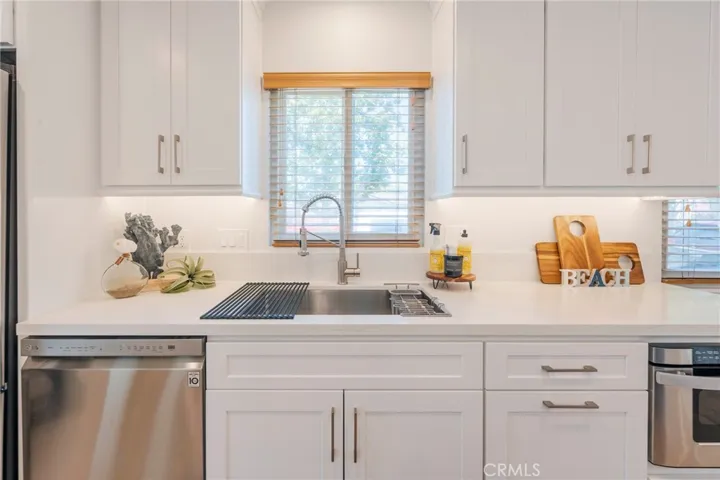 The Kitchen features a Brand New Dishwasher, convenient Pull-out Trash Cabinet and Microwave Drawer.