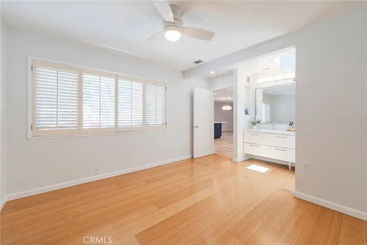 The Secondary Bedroom features Bamboo Flooring and an extra large Sink/Vanity with lots of storage.