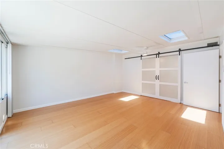 The Bonus/Flex Room is Light and Bright featuring Skylights and Sliders leading to Outdoor Patio Space.