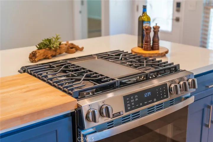 A Five Burner Brand New Gas Range with Griddle.
