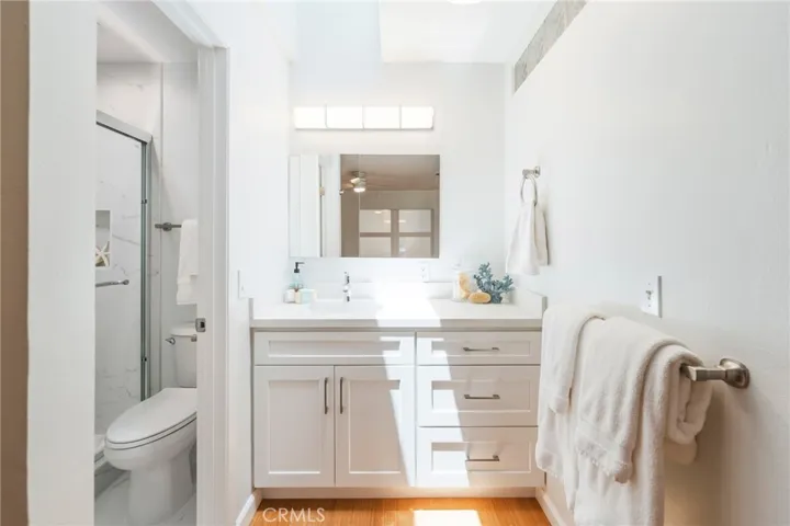 The Primary Bedroom features a Brand-New Custom Vanity with Quartz Counters and Tons of Storage.