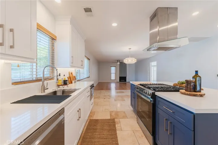 The view looking from the Kitchen into the Spacious Dining Area and Living Room.