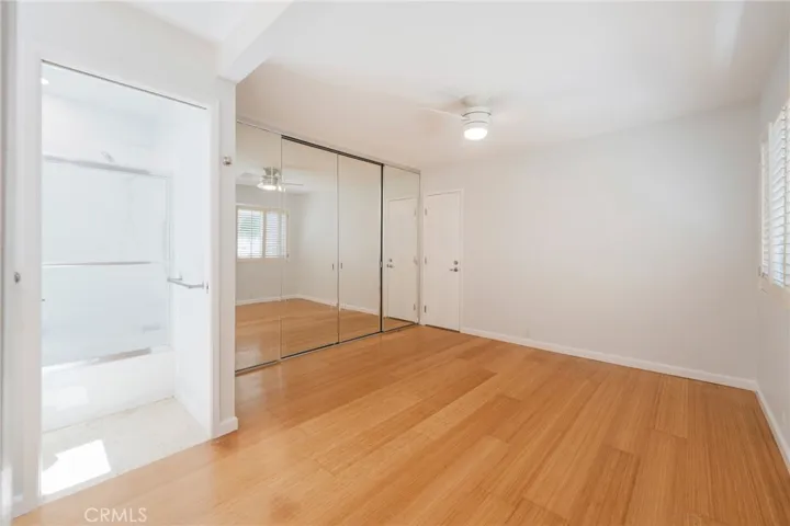 The Secondary Bedroom offers direct access to the Garage and Laundry Area.
