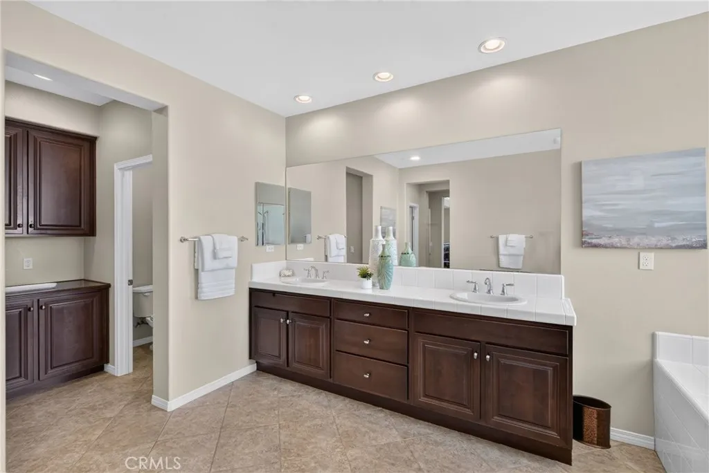 Primary Bathroom showing Dual Vanities
