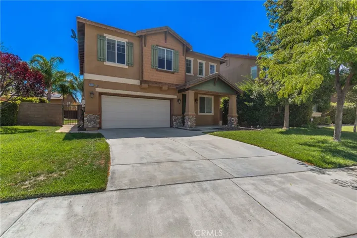 Inviting Two-Story Exterior With Extended Driveway And Attached Garage