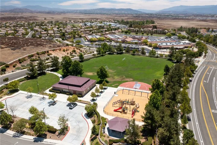 Nearby Community Park Offering Basketball Courts, Playgrounds, And Open Green Space