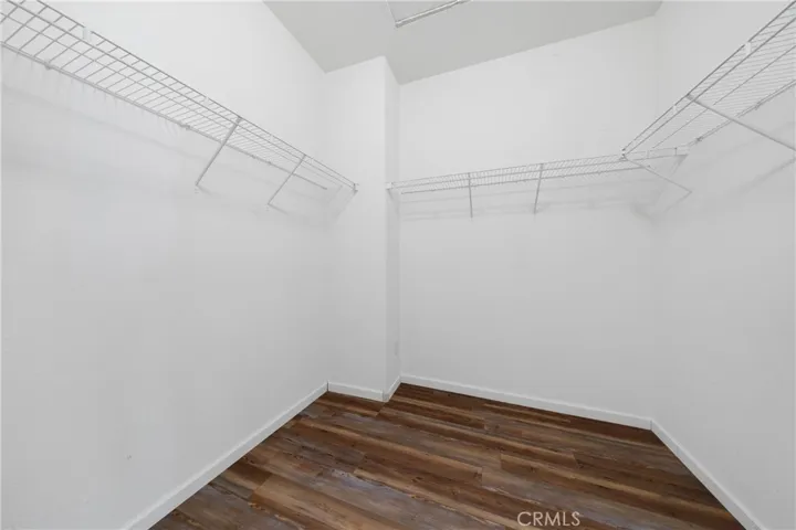 Large Walk-In Closet With Custom Wire Shelving And Ample Storage Space