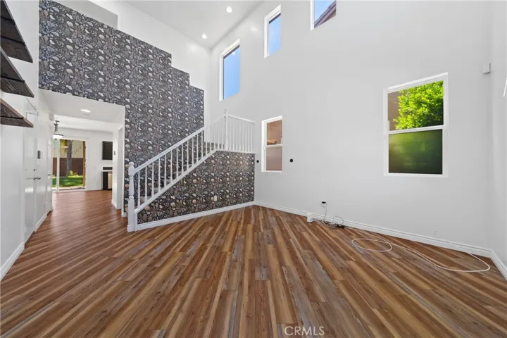 Spacious Open-Concept Living Area With Dramatic Two-Story Ceilings