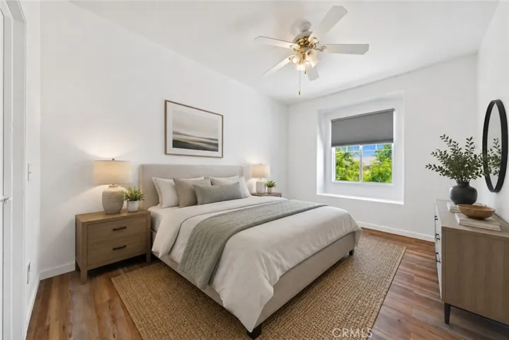 Bright And Spacious Secondary Bedroom With Ceiling Fan And Large Window - Digitally Staged